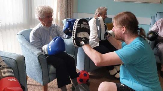 Queensridge Court Residents Enjoying Taking Part In A Boxing Session
