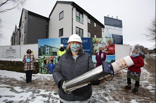 Standing outside of Newton House with the time capsule