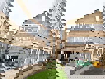 Front-side of the building at Albuhera Close with outside seating