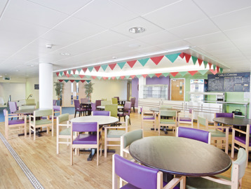 Cafe/bistro area with tables and chairs in the dining area