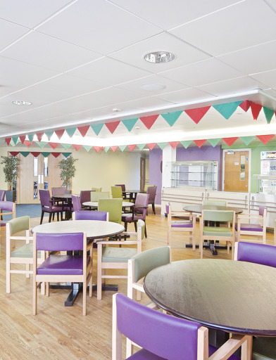 Cafe/bistro area with tables and chairs in the dining area