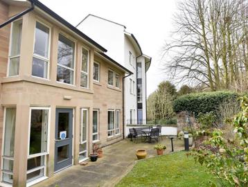 Outside of the scheme at Waltham House surrounded by a patio and grassed area