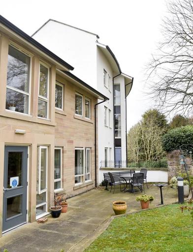 Outside of the scheme at Waltham House surrounded by a patio and grassed area 