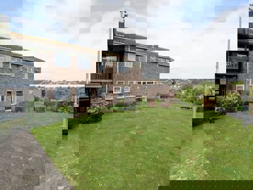 Large grassed area to the front of the scheme entrance
