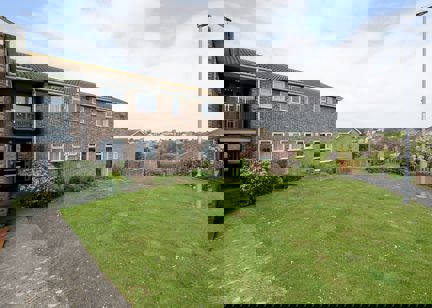 Large grassed area to the front of the scheme entrance