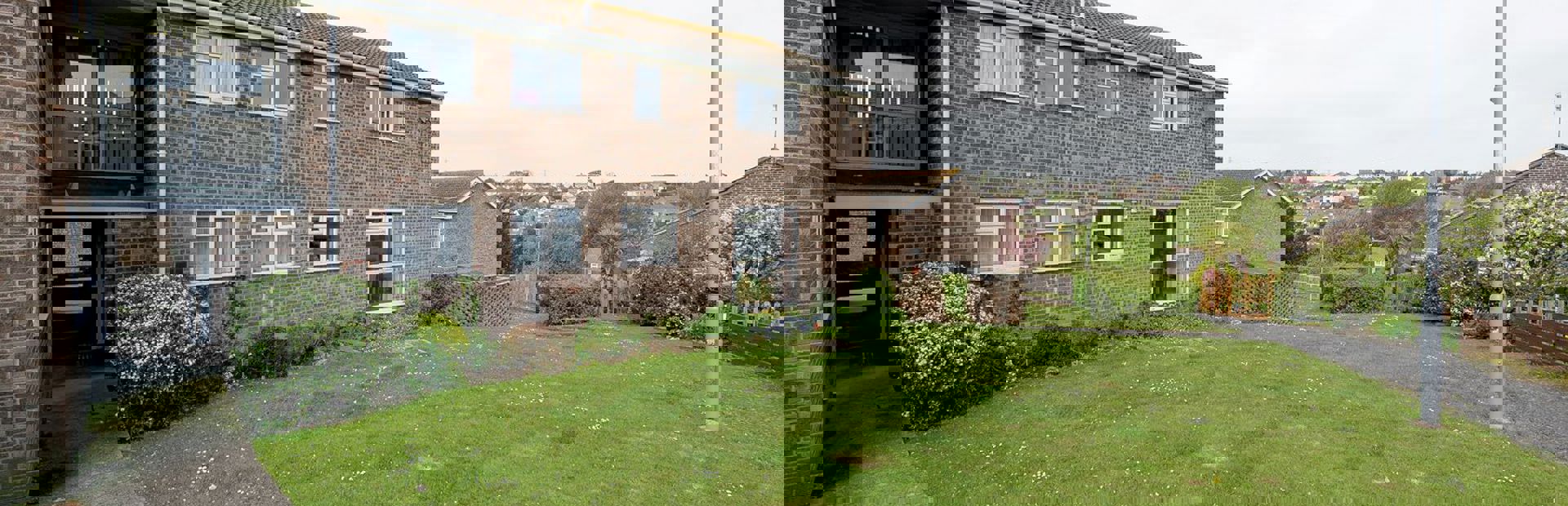 Large grassed area to the front of the scheme entrance