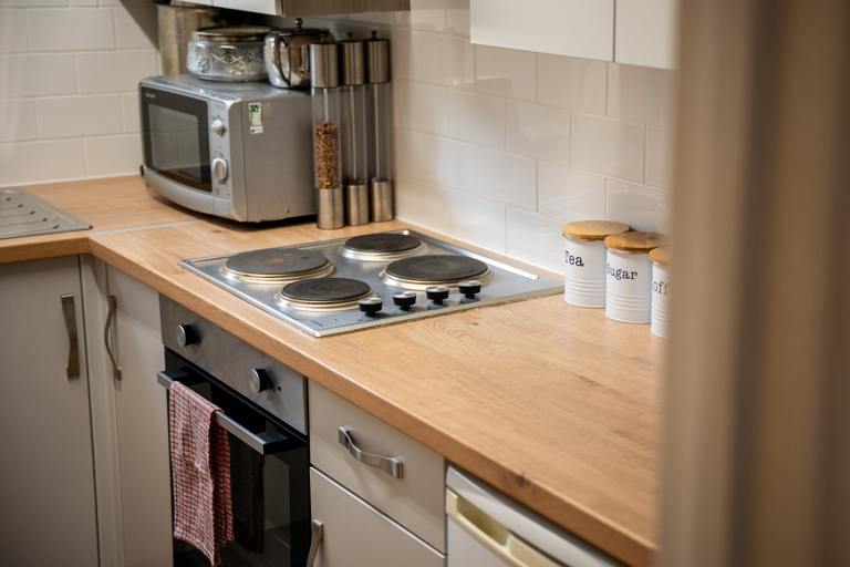 Modern kitchen with oven, hob and extractor fan