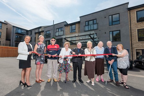 Ribbon cutting outside Bowland View