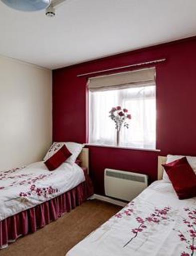 Two single beds in the bedroom of an apartment 