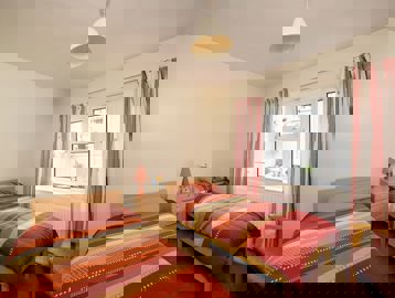 Two single beds in the bedroom of an apartment