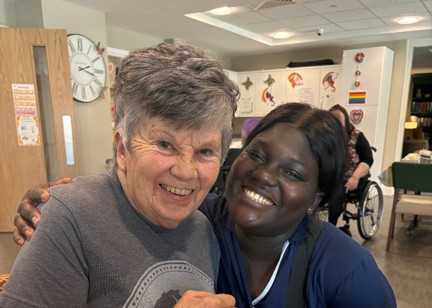 Resident Janet with a care worker