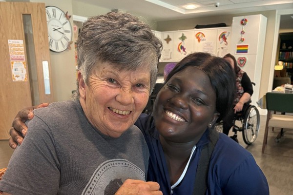 Resident Janet with a care worker