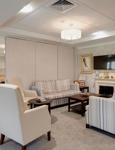 Open-plan communal lounge and dining area for residents in a modern, stylish decor 