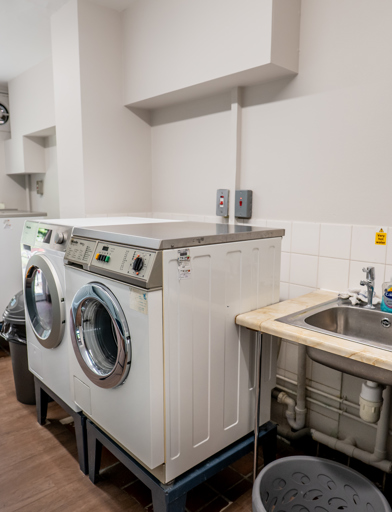 William Griffiths Court internal shot: A communal laundry room with washers and dryers 
