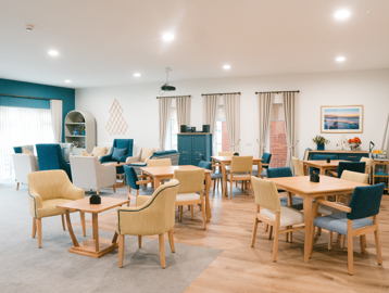 tables and chairs in the scheme communal area