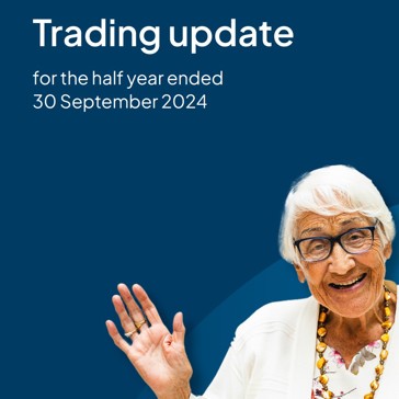 The front cover of the Trading Update with a resident waving 