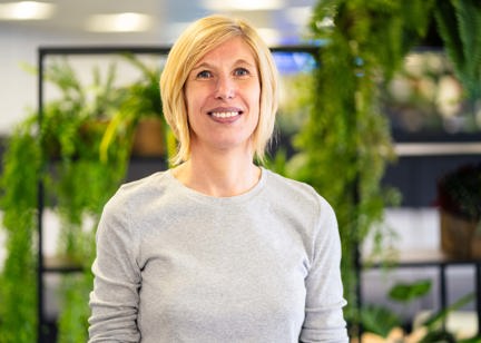 A smiling woman in an office