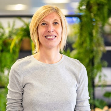A smiling woman in an office