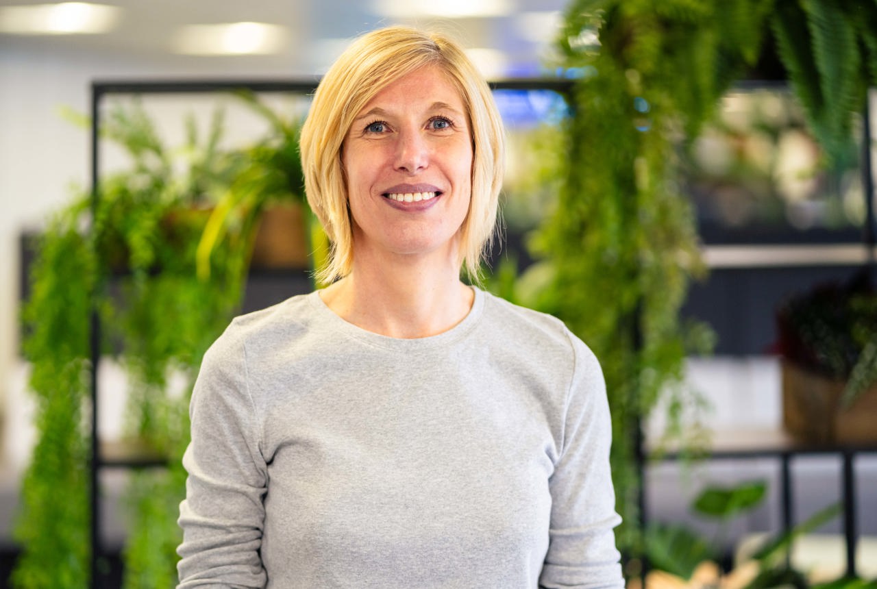 A smiling woman in an office