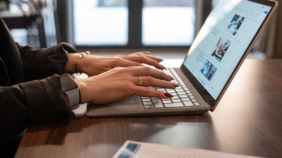 Typing on a laptop