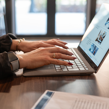 Typing on a laptop