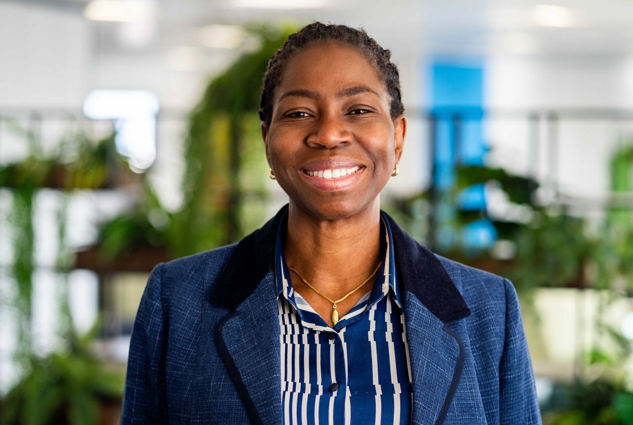 Housing 21 Board Member, Dr Bola Owolabi, smiles into the camera