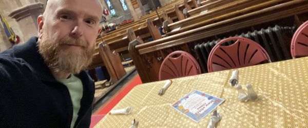 A man takes a selfie in a church