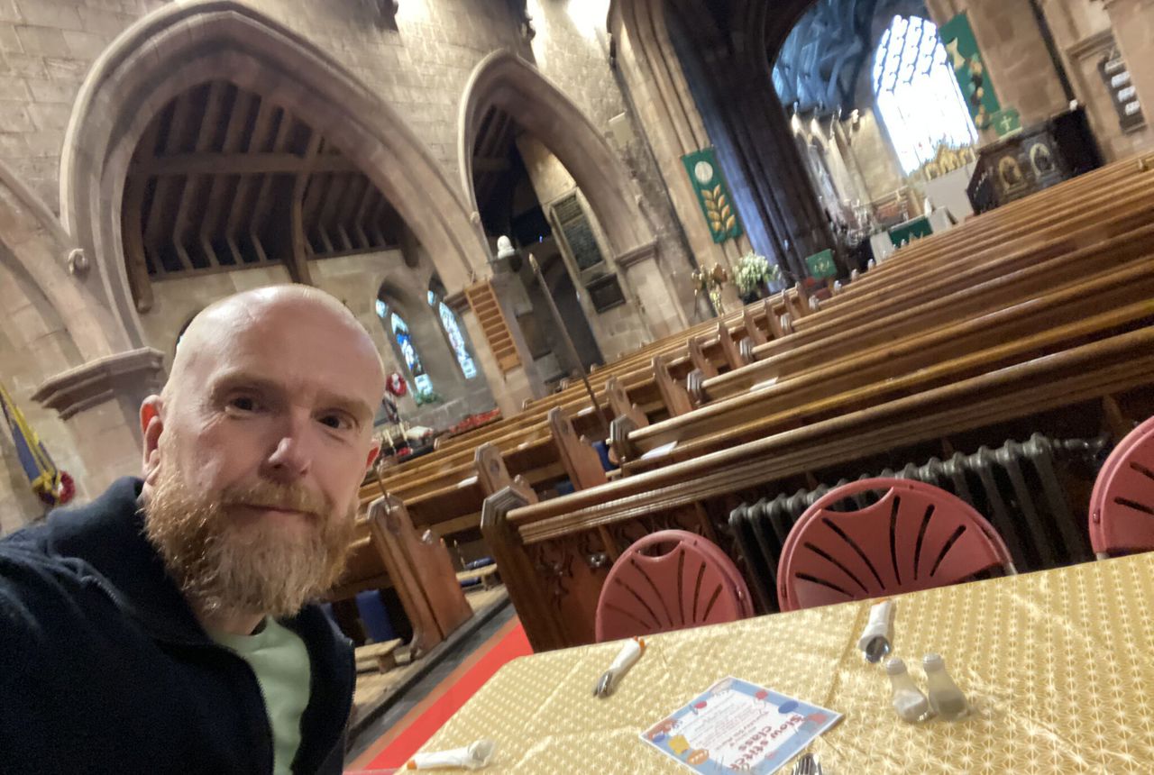 A man takes a selfie in a church