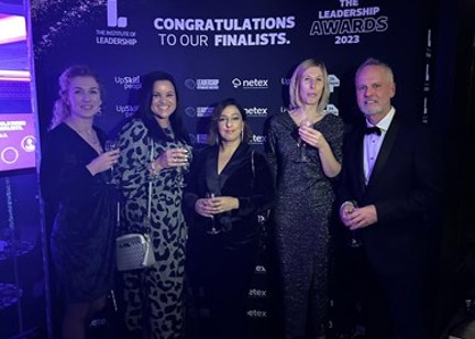 Housing 21 colleagues celebrating at the Leadership Awards 2023 in smart evening wear.