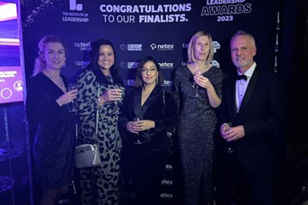 Housing 21 colleagues celebrating at the Leadership Awards 2023 in smart evening wear.