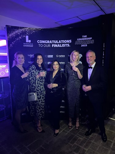 Housing 21 colleagues celebrating at the Leadership Awards 2023 in smart evening wear.