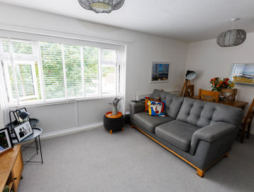 Lounge area in a flat showing sofa and dining table