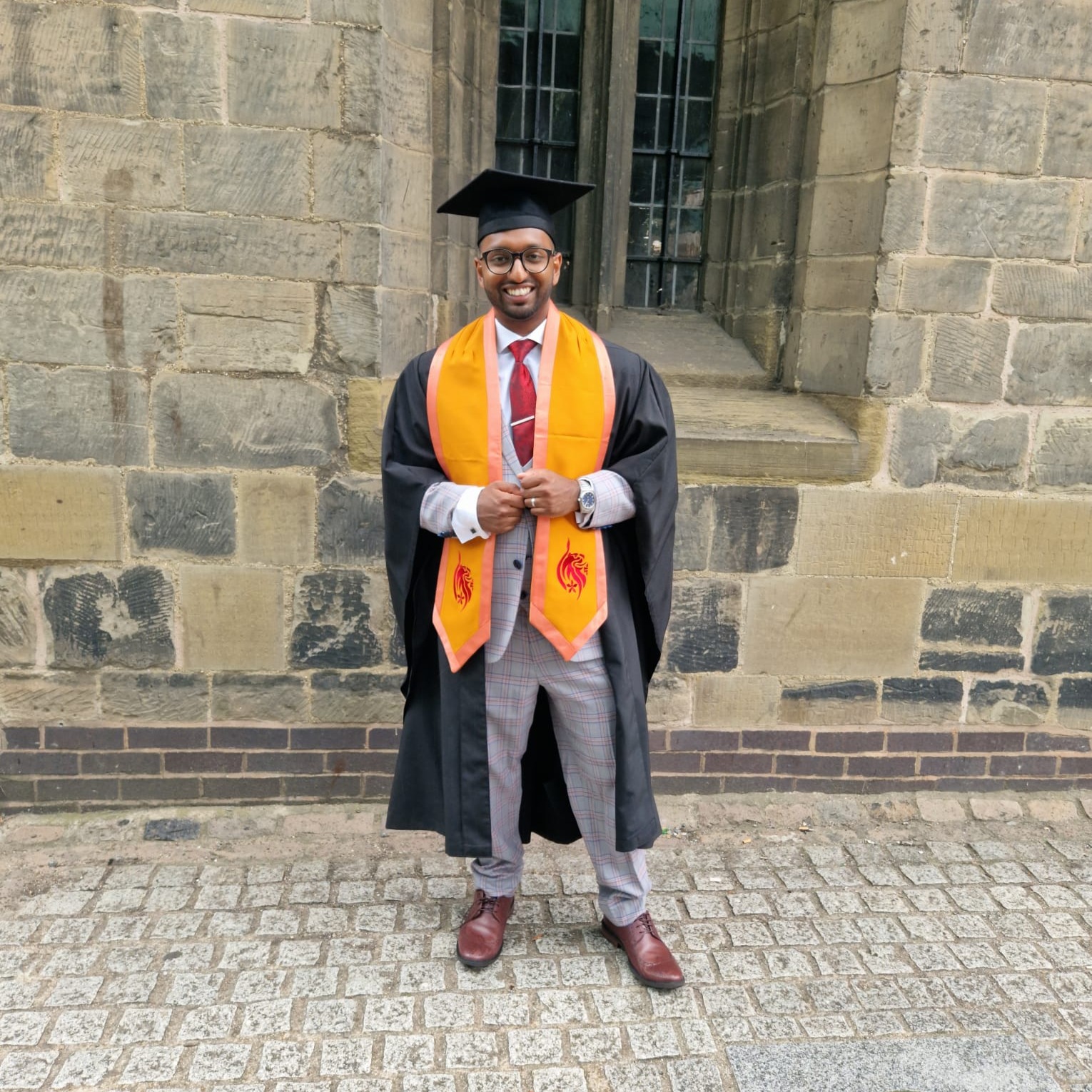 Employee, Shaf Hussain at graduation after completing a level five, University Certificate of Professional Development in Management at DeMontford University