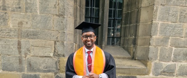Employee, Shaf Hussain at graduation after completing a level five, University Certificate of Professional Development in Management at DeMontford University
