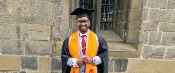 Employee, Shaf Hussain at graduation after completing a level five, University Certificate of Professional Development in Management at DeMontford University