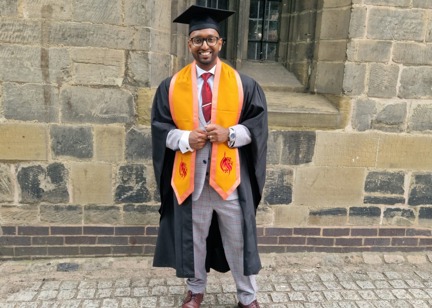 Employee, Shaf Hussain at graduation after completing a level five, University Certificate of Professional Development in Management at DeMontford University