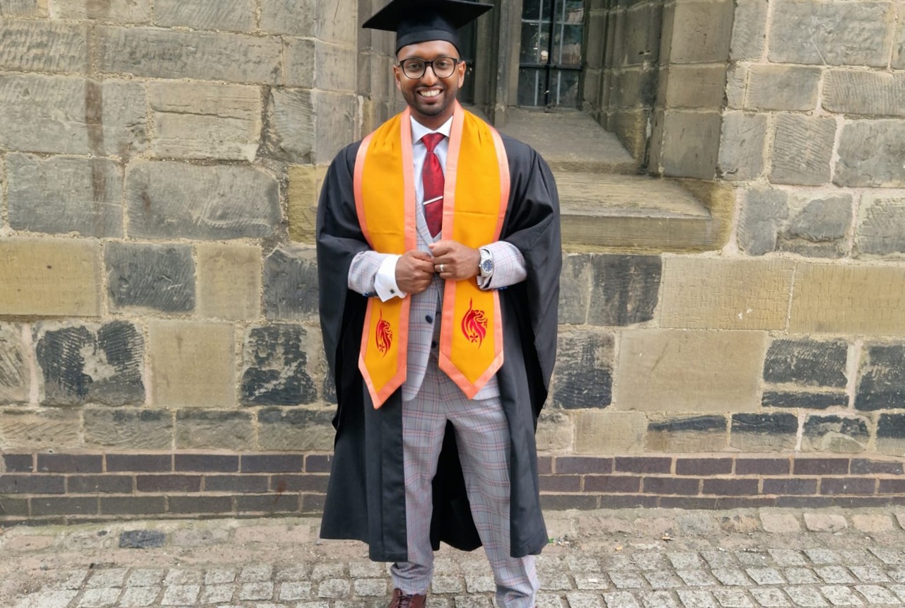 Employee, Shaf Hussain at graduation after completing a level five, University Certificate of Professional Development in Management at DeMontford University