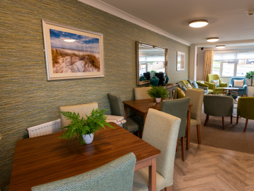 Communal dining area with tables and chairs