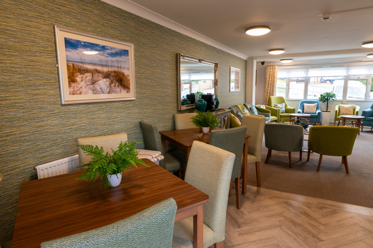 Communal dining area with tables and chairs