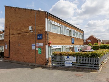Outside the scheme with car park sign