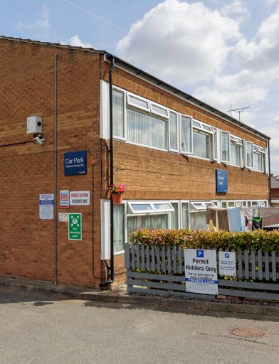 Outside the scheme with car park sign 