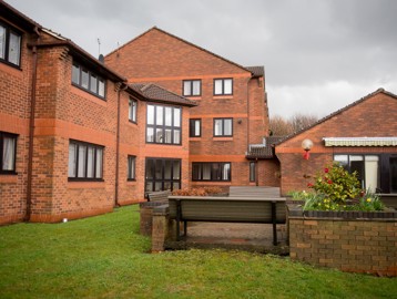 Benches in an outside garden space at Avril Court