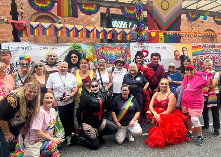 Housing 21 Employees And Residents At Manchester Pride 2025 In Front Of A Float