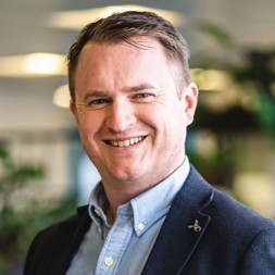 Andy Shaw, Chief Financial Officer of Housing 21, smiles into the camera