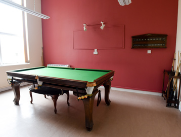 Games room with small snooker table
