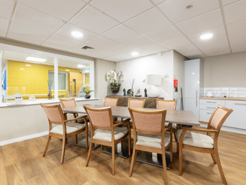 a communal kitchen with dining table