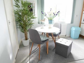 A stylish kitchen dining area in an apartment at Goodman Court