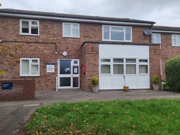 The front of Howard Court, showing signage, and the entrance