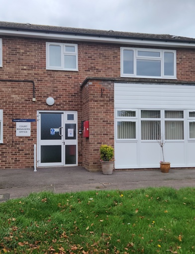 The front of Howard Court, showing signage, and the entrance