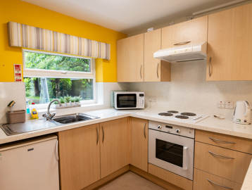 Kitchen with oven, hob and extractor fan